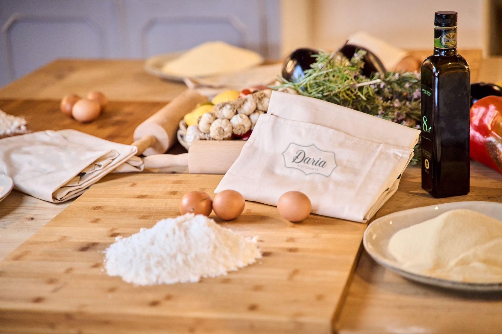 Flour, eggs and a Ristorante Daria apron on the work table